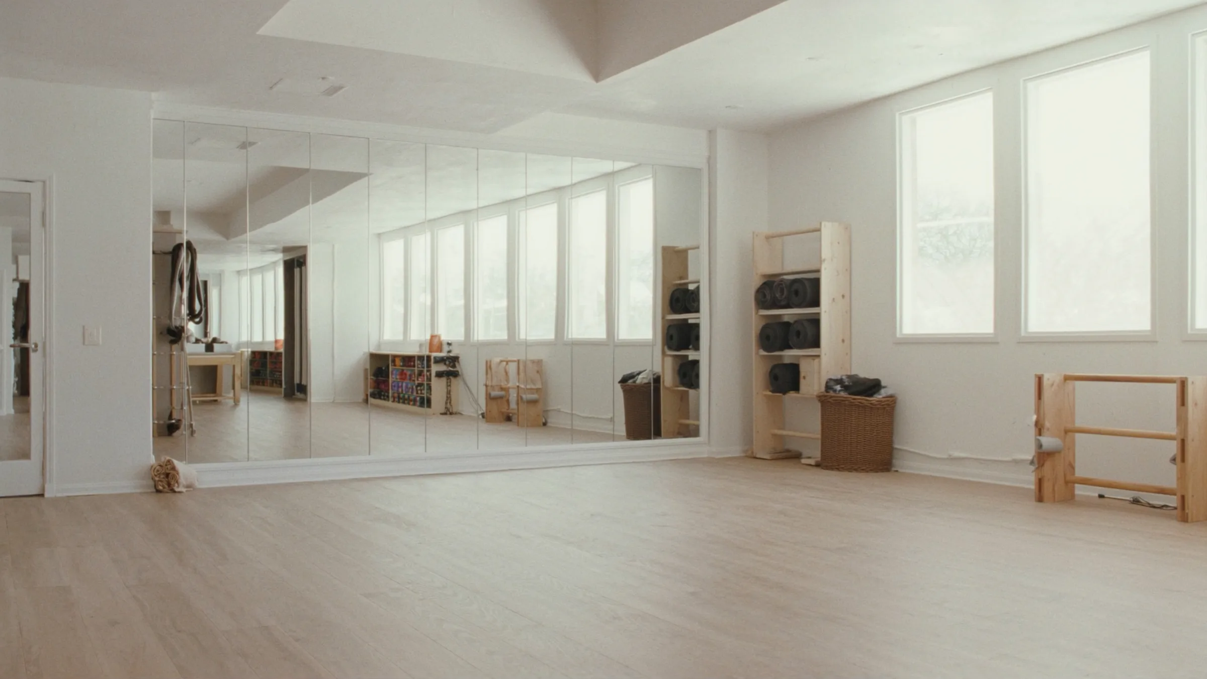 Gym marketing, fitness studio, mirrored wall and rolled yoga mats