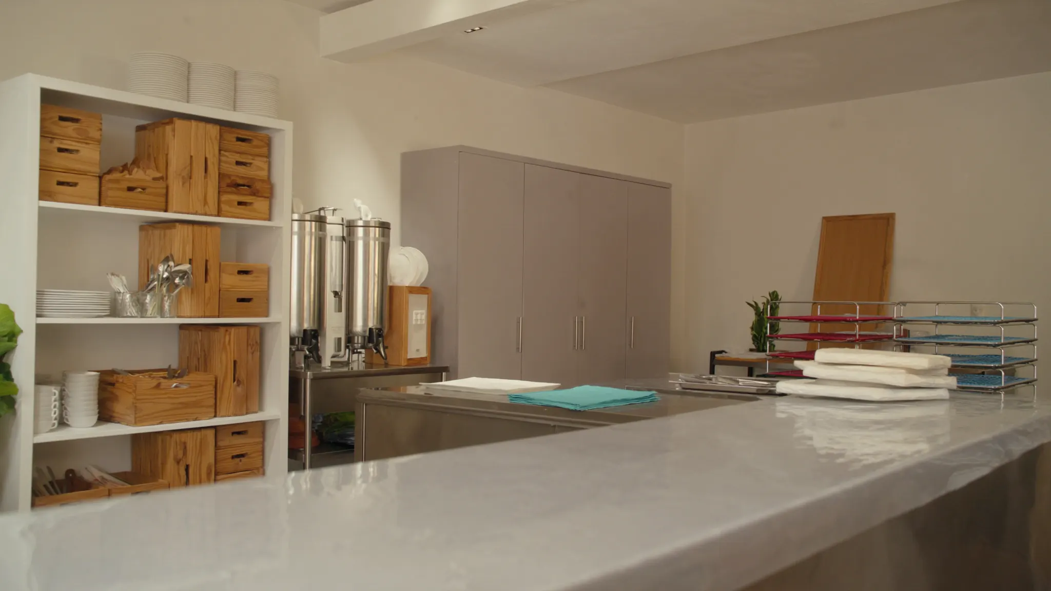 Catering marketing, catering kitchen, stainless counters and wooden boards
