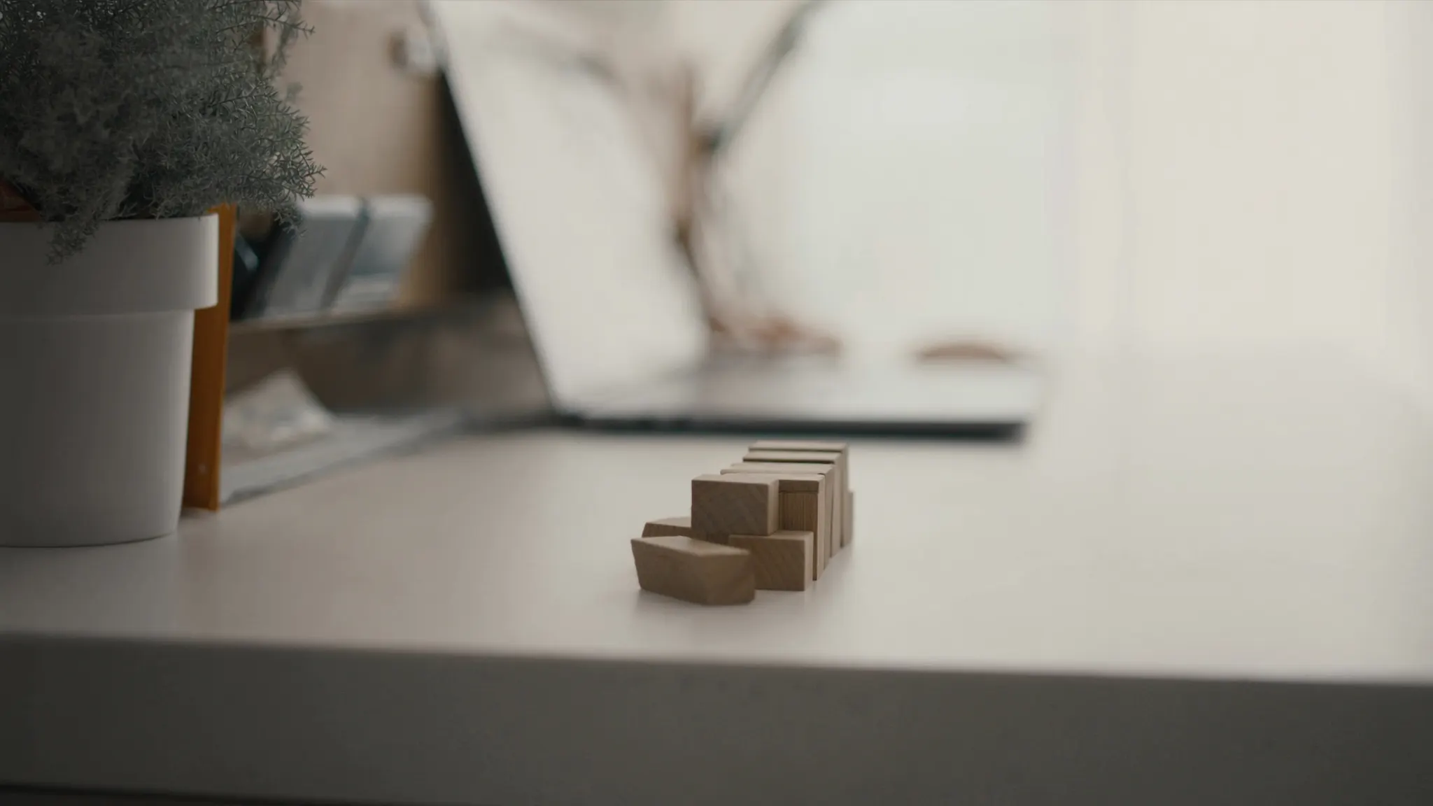 Tools we connect, desk with a row of small wooden blocks lined up