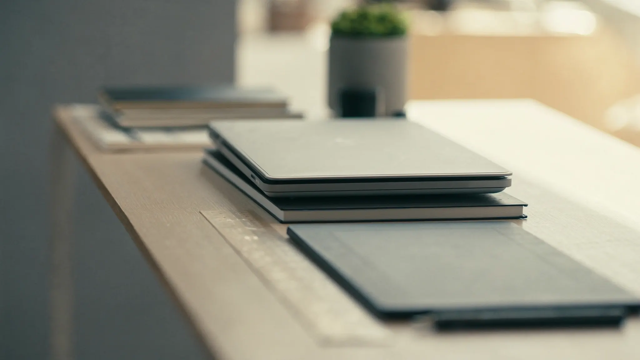Redesigning Without Losing Traffic, desk with stacked devices and a graphics tablet