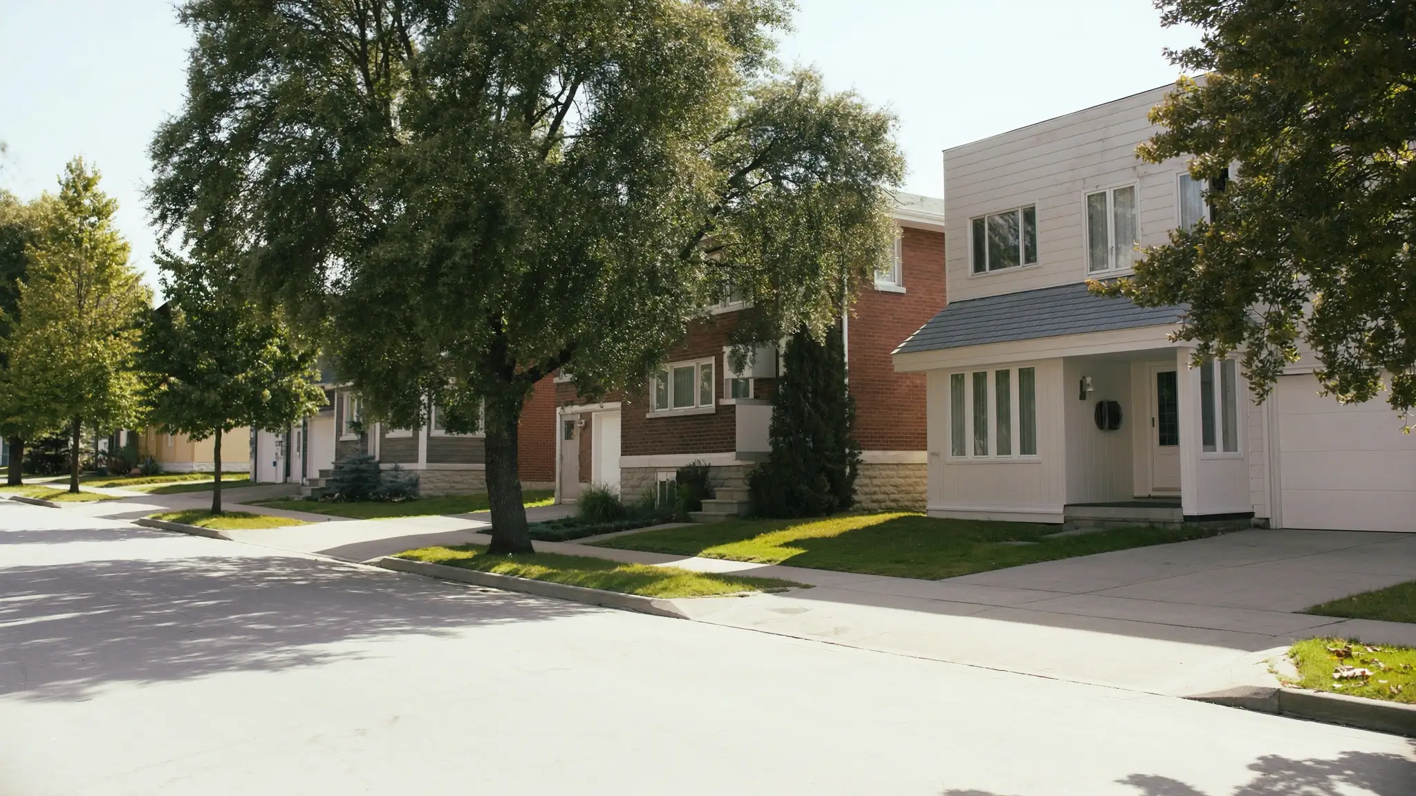 Greater Montreal, marketing agency service areas, tree-lined residential street in a Quebec suburb